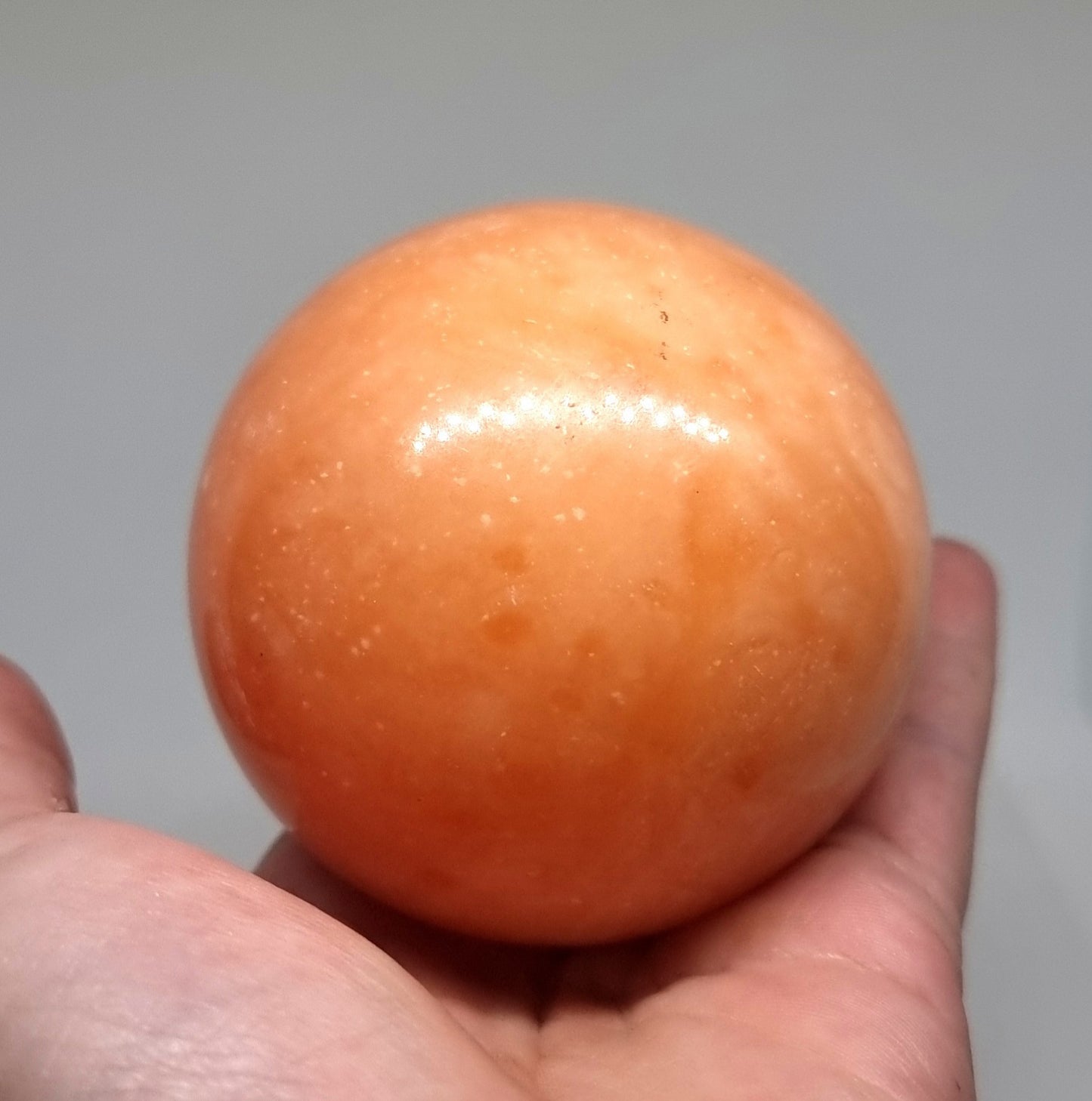 ORANGE CALCITE POLISHED SPHERE 7 cm - SPIRITUAL GROWTH
