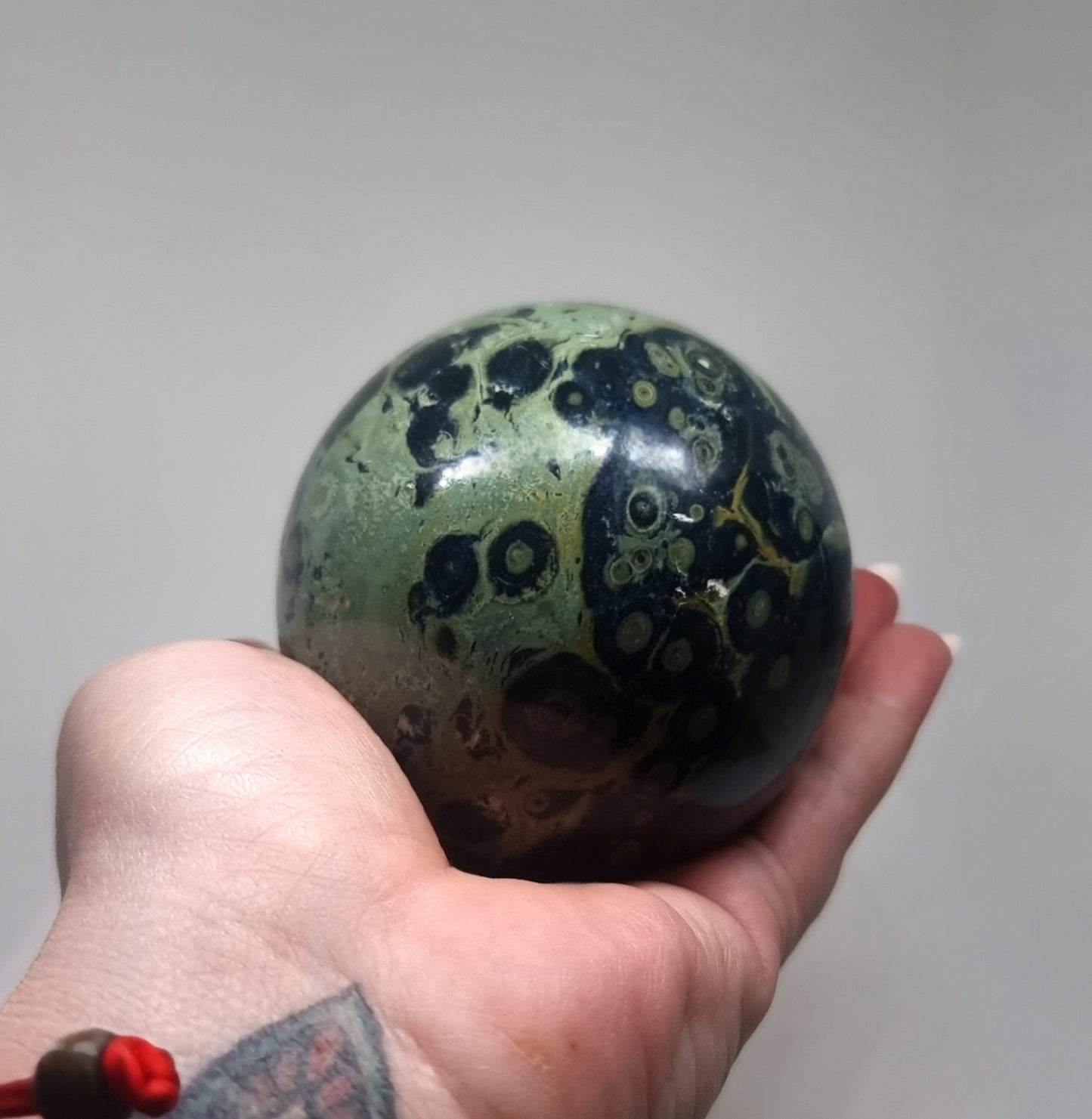 POLISHED KAMBABA JASPER SPHERE - PEACE & TRANQUILITY