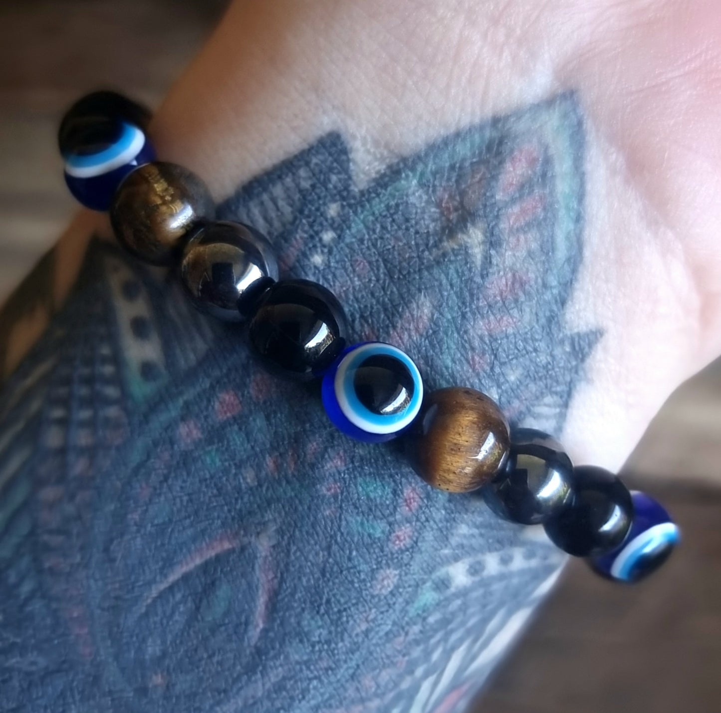 AGAINST EVIL EYE TRIPLE PROTECTION BRACELET 8 mm - TIGER EYE, HEMATITE & OBSIDIAN