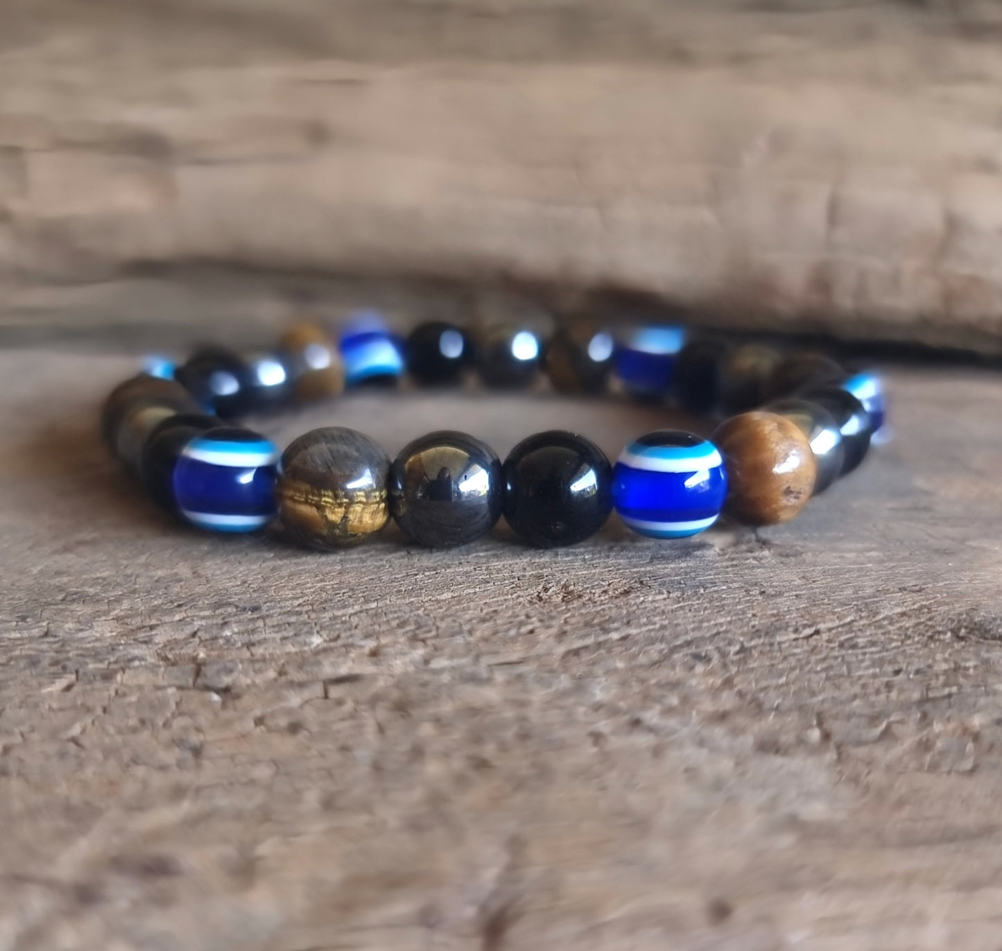 AGAINST EVIL EYE TRIPLE PROTECTION BRACELET 8 mm - TIGER EYE, HEMATITE & OBSIDIAN