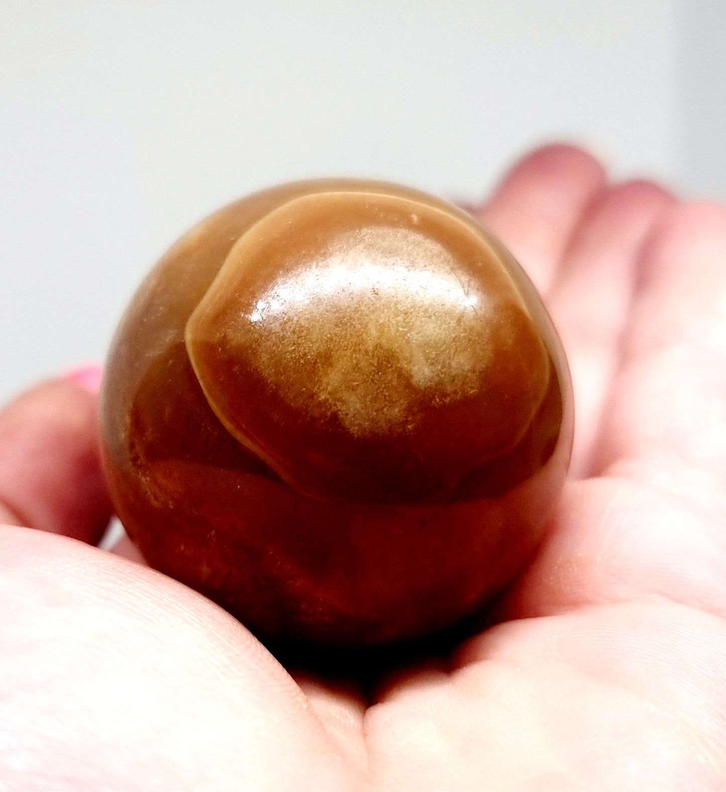 POLISHED CARAMEL SWIRL ARAGONITE SPHERE 129 g - PATIENCE