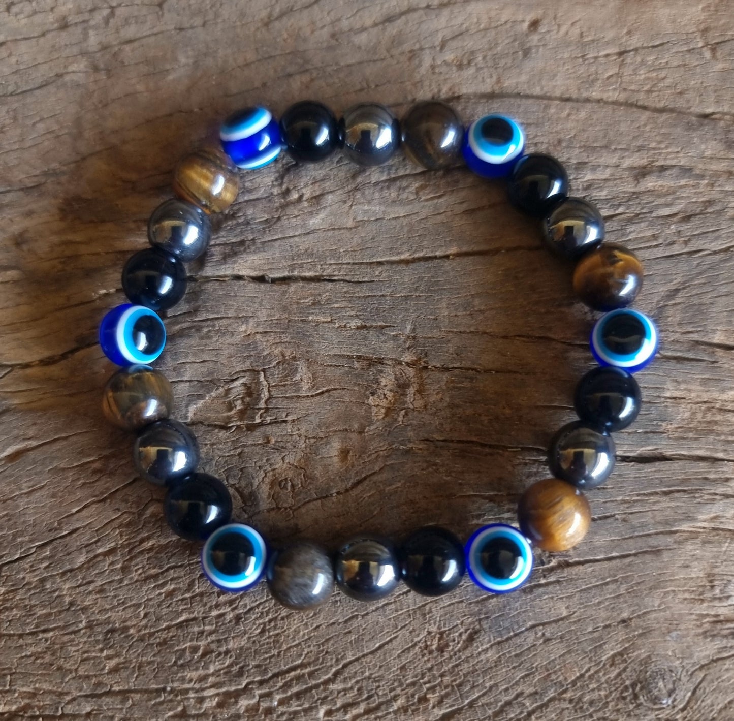 AGAINST EVIL EYE TRIPLE PROTECTION BRACELET 8 mm - TIGER EYE, HEMATITE & OBSIDIAN